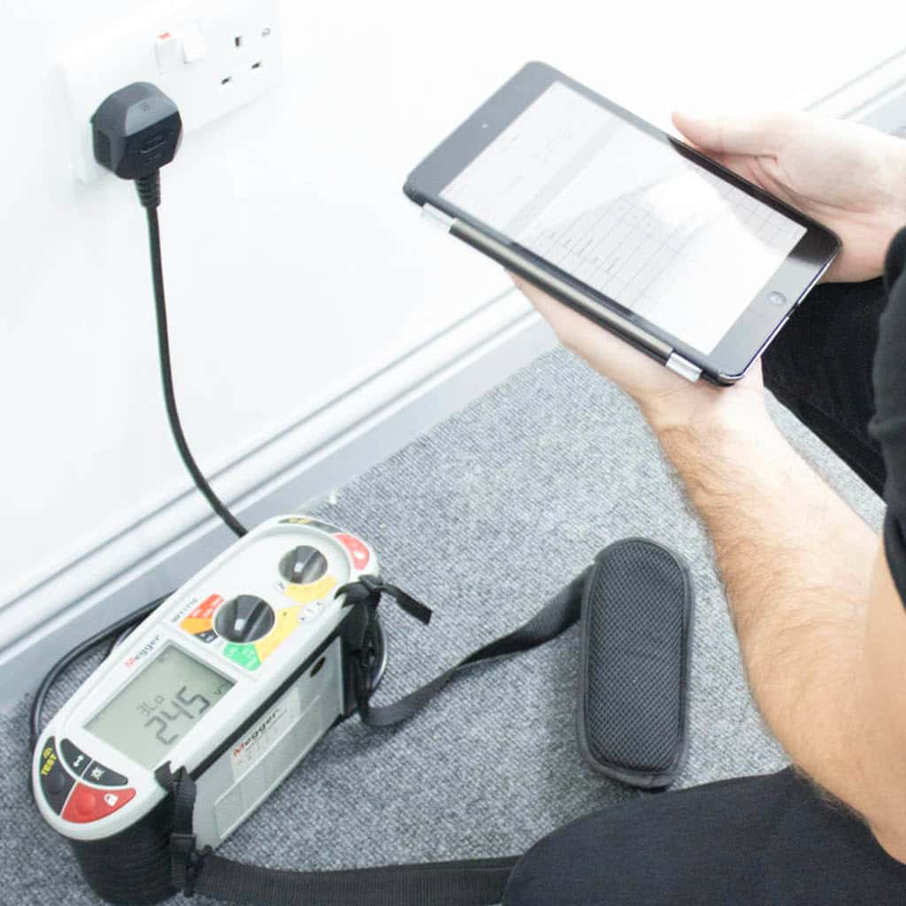 Electrician conducting an EICR in an Edinburgh rental property.