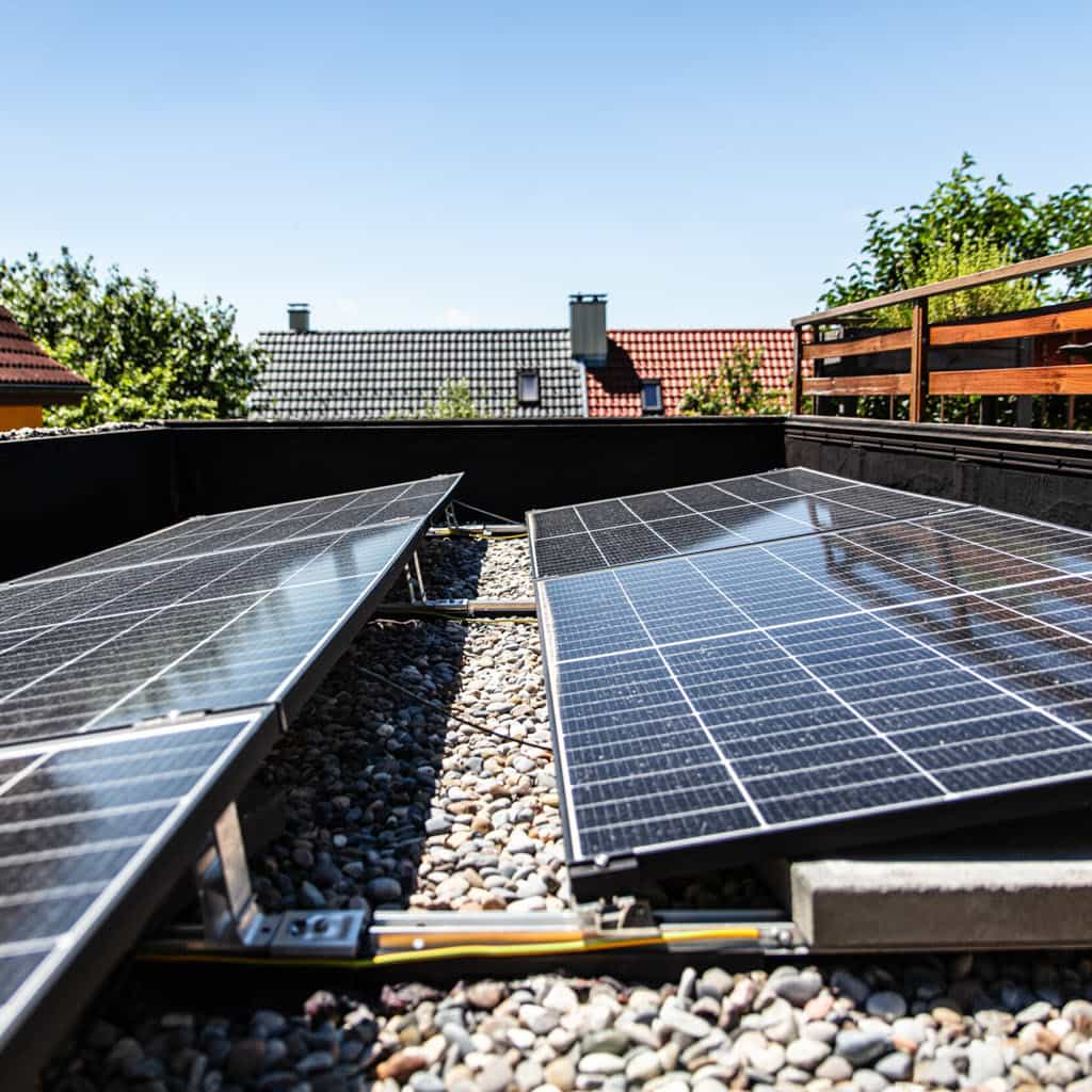 Solar panels on flat roof installed with a ballast mounting system.