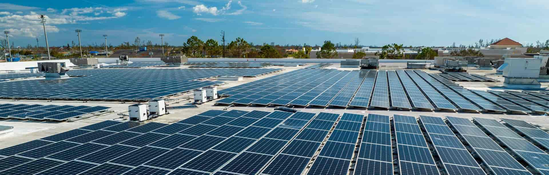 Commercial solar panels installed on this industrial building.